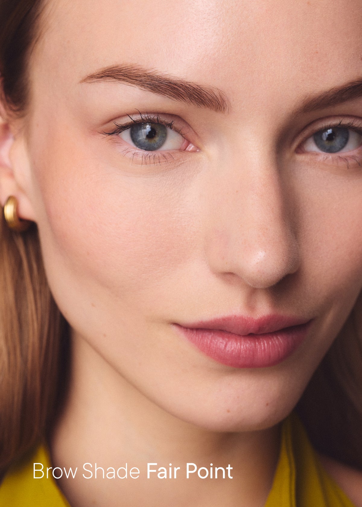 Woman with softly defined light brows, with the text "Brow Shade Fair Point"