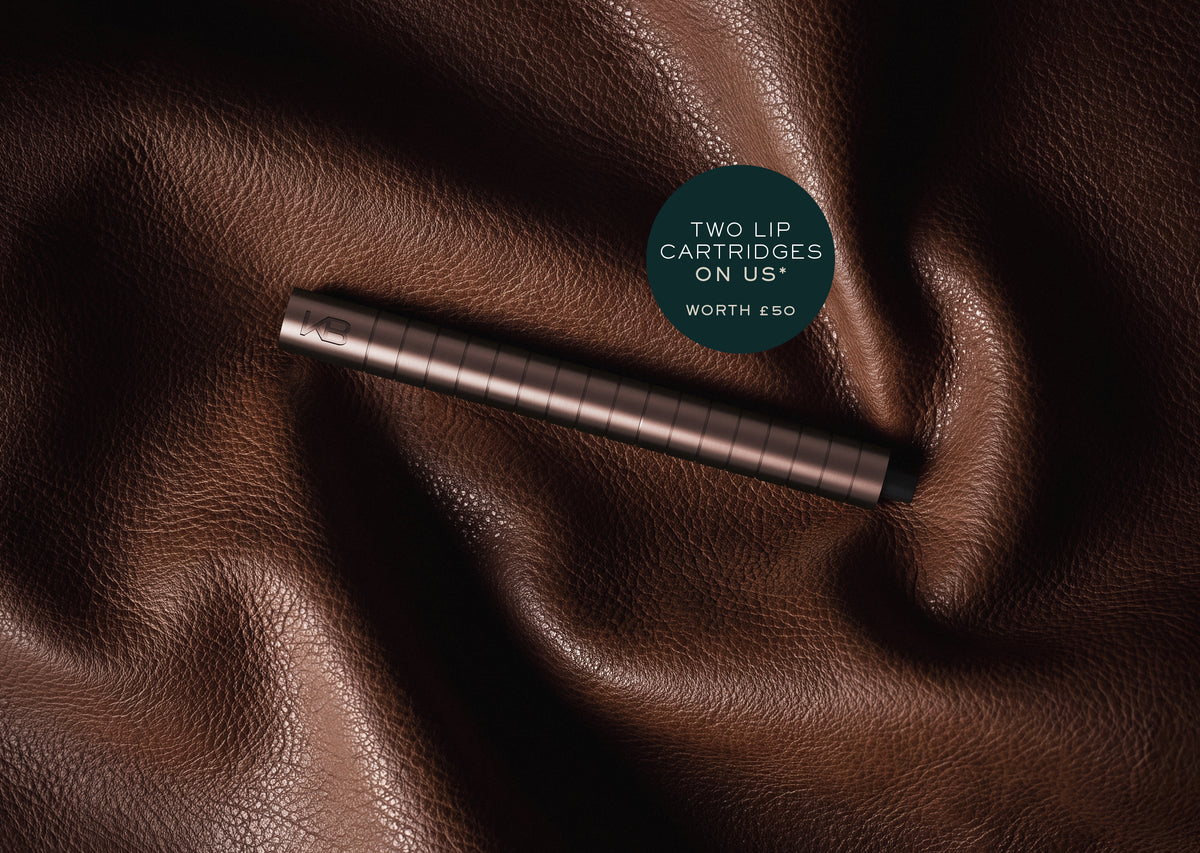Karen Betts pen in Rosewood on brown leather with a roundel reading "Two lip cartridges on us* – worth £50"