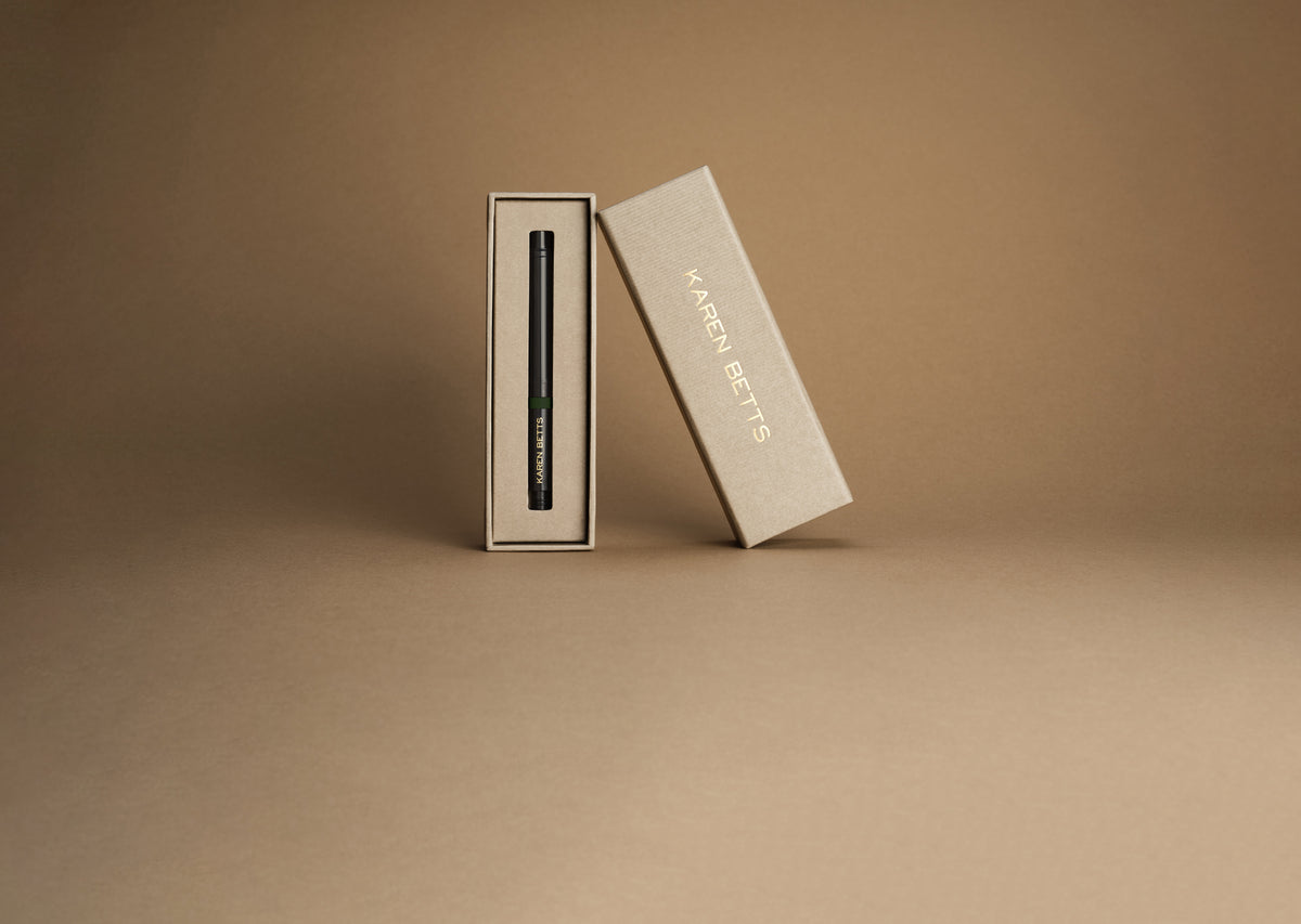 Karen Betts eye pencil cartridge in its open cream box, with the lid leaning alongside